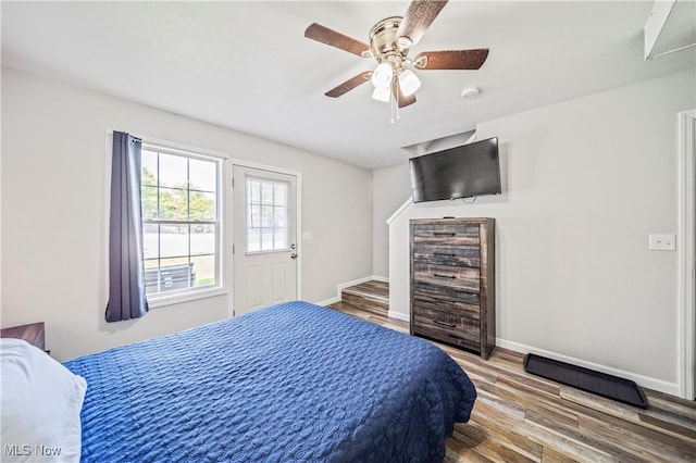 bedroom with ceiling fan and hardwood / wood-style floors