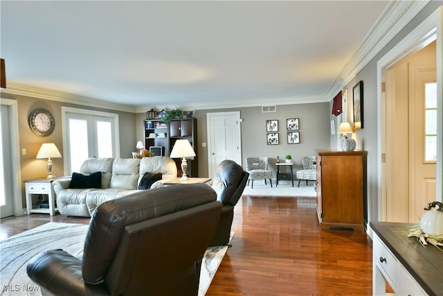 living room featuring crown molding and dark hardwood / wood-style flooring