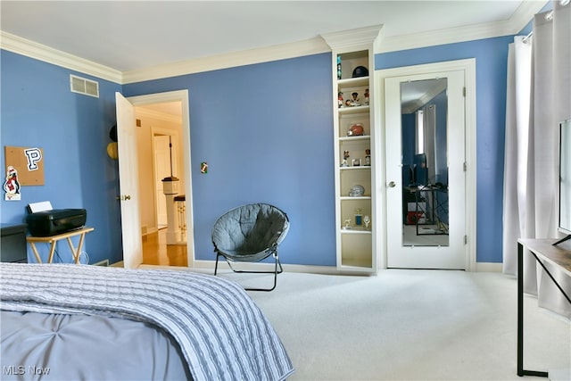 carpeted bedroom with ornamental molding