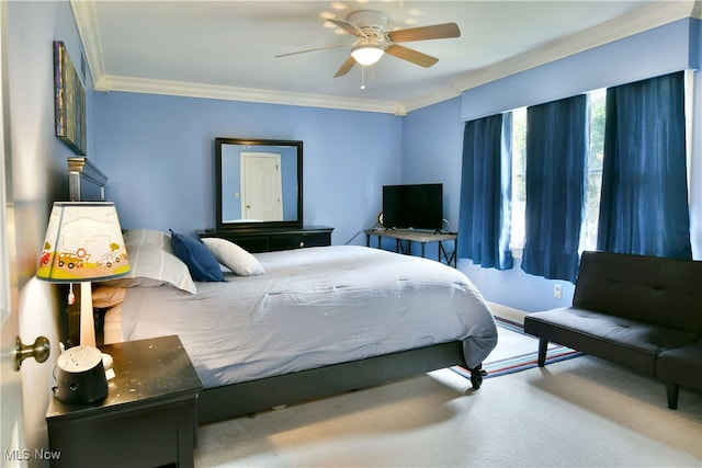 bedroom with carpet flooring, ornamental molding, and ceiling fan