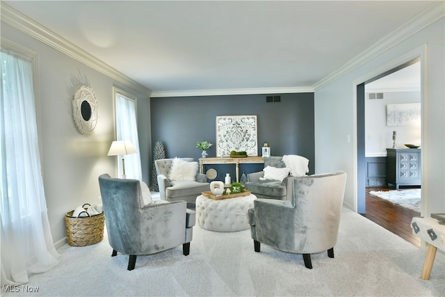 living room featuring ornamental molding and wood-type flooring