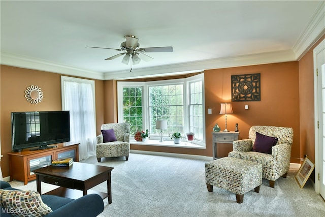 interior space with ornamental molding, ceiling fan, and carpet floors