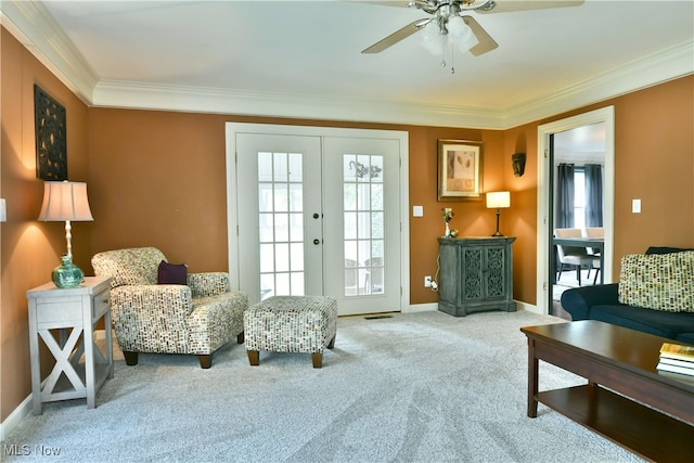 interior space with ornamental molding, ceiling fan, and french doors