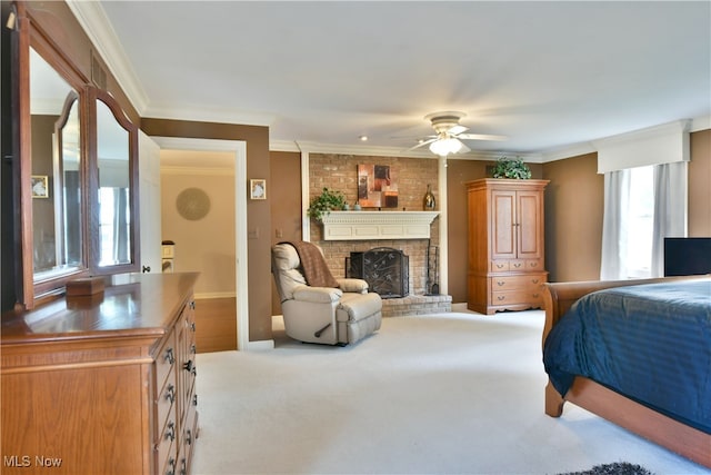 bedroom with multiple windows, crown molding, light carpet, and a brick fireplace