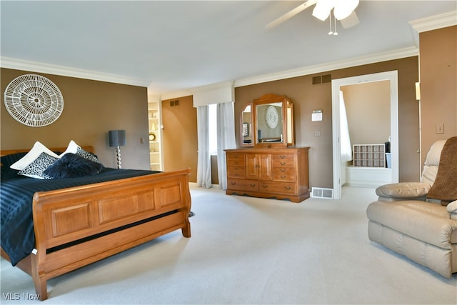 carpeted bedroom featuring crown molding and ceiling fan