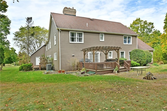 rear view of house featuring a lawn, a pergola, a deck, and central AC unit