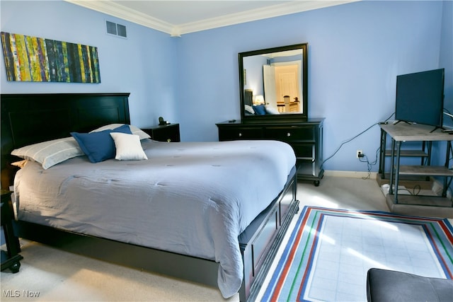 carpeted bedroom featuring crown molding