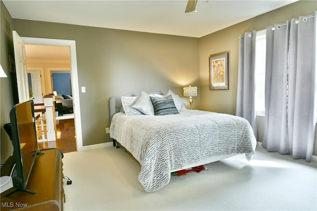 bedroom featuring ceiling fan and carpet floors