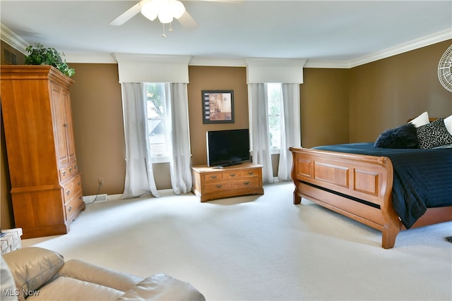 carpeted bedroom featuring multiple windows, ornamental molding, and ceiling fan