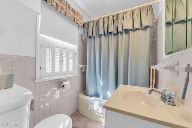 full bathroom featuring shower / bath combination with curtain, toilet, tile walls, and vanity