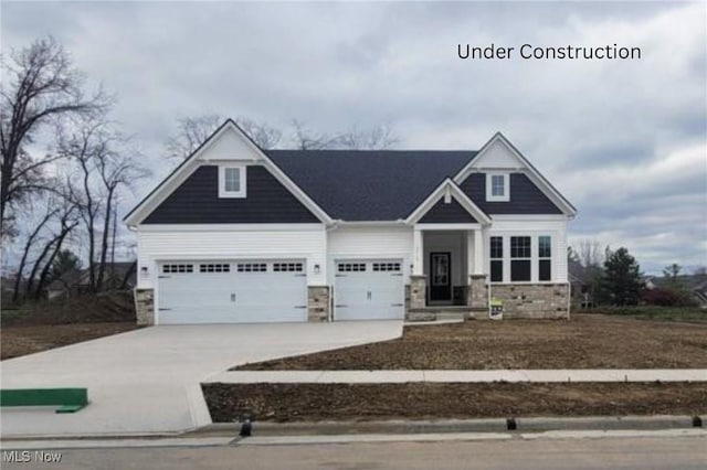 craftsman house with a garage