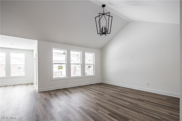 interior space featuring lofted ceiling with beams, dark hardwood / wood-style floors, and an inviting chandelier