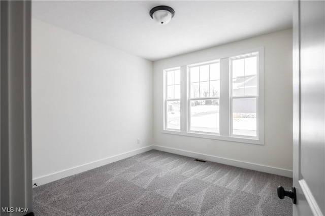 view of carpeted spare room