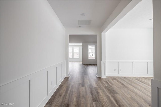 corridor with wood-type flooring