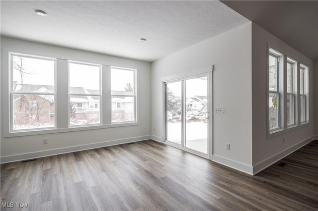 empty room featuring wood-type flooring