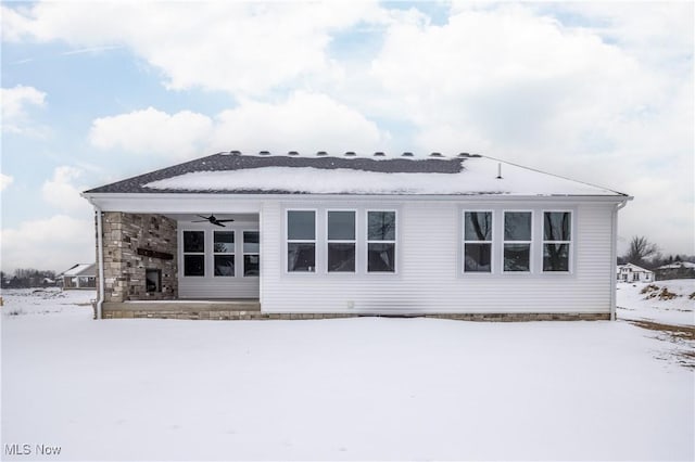 snow covered house with ceiling fan