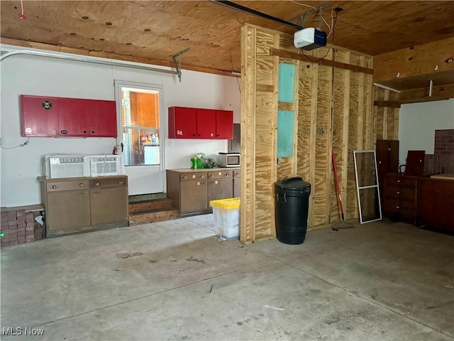 garage with wooden ceiling and a garage door opener