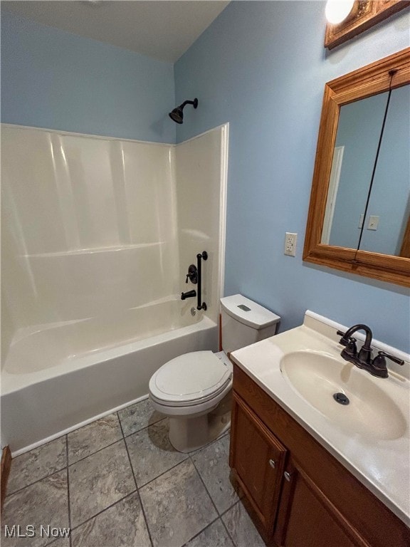 full bathroom with tub / shower combination, tile patterned flooring, vanity, and toilet