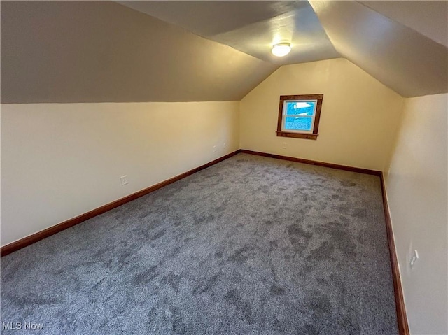 7836 Oak St, Masury, OH 44438 - bonus room with baseboards, lofted ceiling, and carpet floors