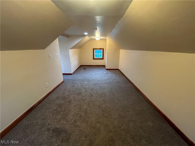 7836 Oak St, Masury, OH 44438 - bonus room featuring baseboards, vaulted ceiling, and carpet floors