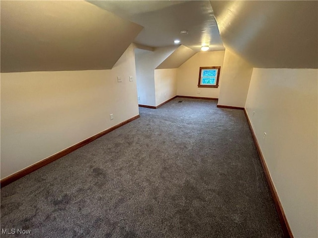 7836 Oak St, Masury, OH 44438 - additional living space with carpet flooring, baseboards, and lofted ceiling