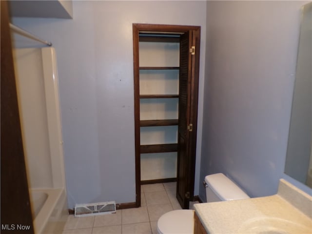 full bathroom featuring tile patterned floors, vanity, toilet, and shower / bathtub combination