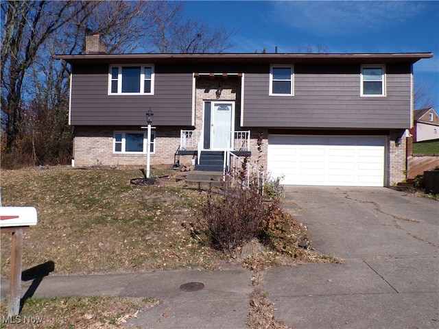 split foyer home featuring a garage