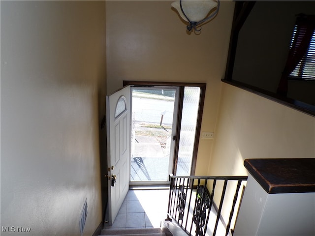 doorway featuring light tile patterned flooring