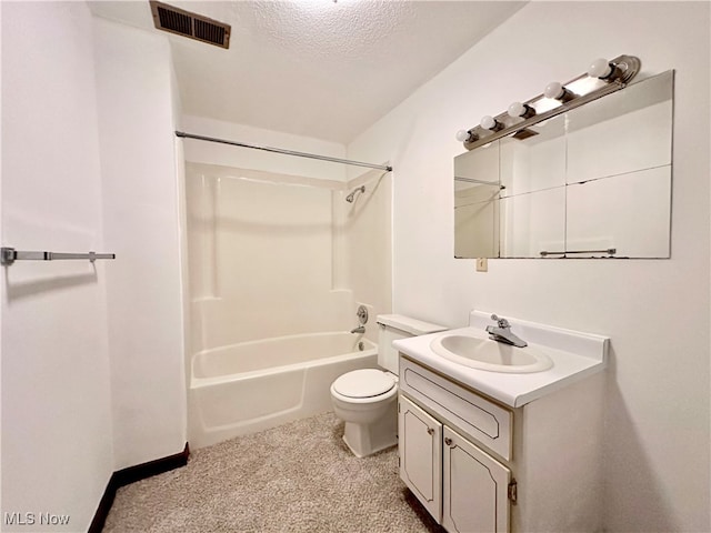 full bathroom featuring a textured ceiling, bathing tub / shower combination, vanity, and toilet