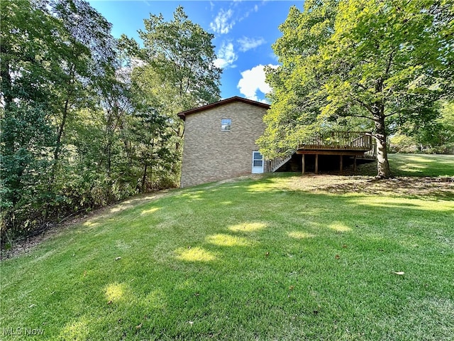 view of yard featuring a wooden deck