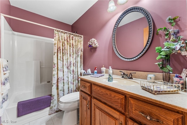 full bathroom with toilet, vanity, tile patterned floors, and shower / tub combo with curtain