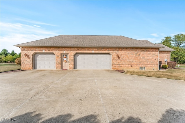 view of side of property featuring a garage