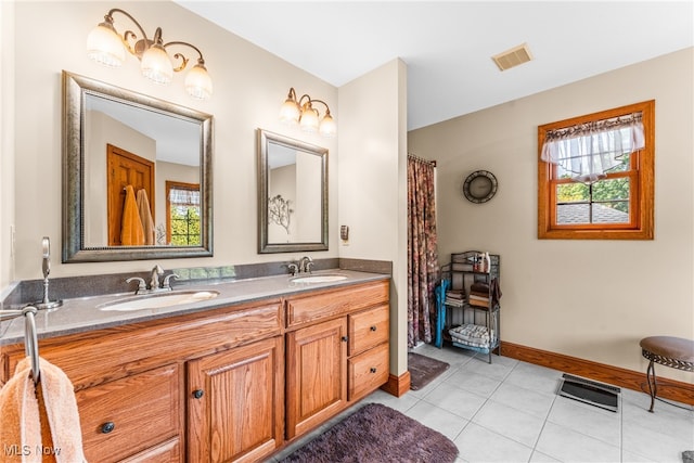 bathroom with vanity and tile patterned floors