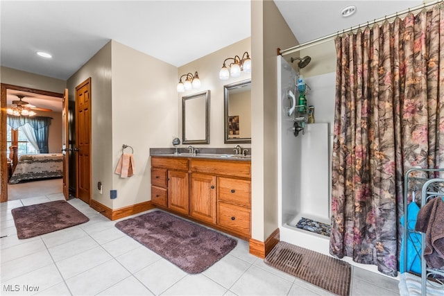 bathroom with tile patterned flooring, vanity, ceiling fan, and a shower with shower curtain