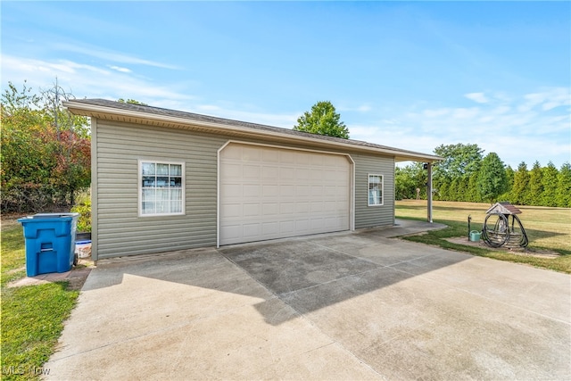 garage featuring a yard