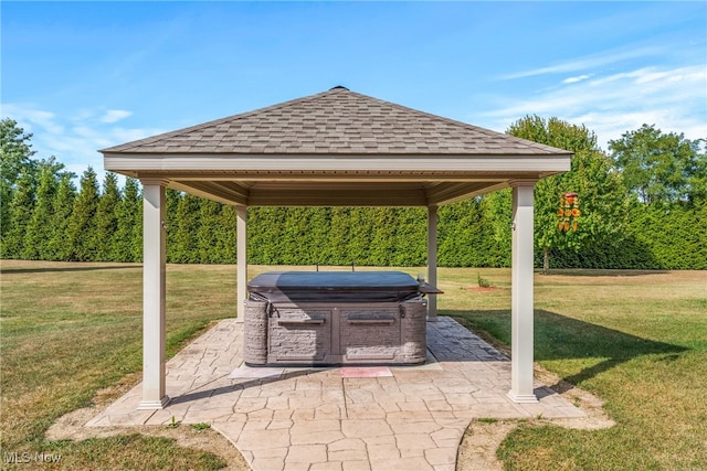 view of patio featuring a gazebo and a hot tub