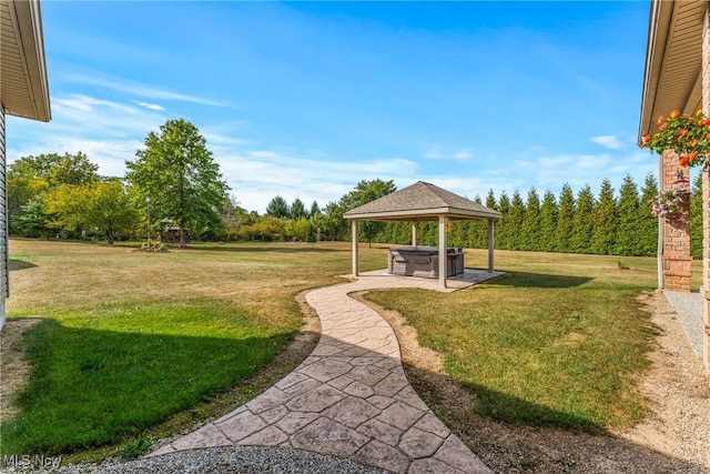 surrounding community featuring a gazebo and a yard