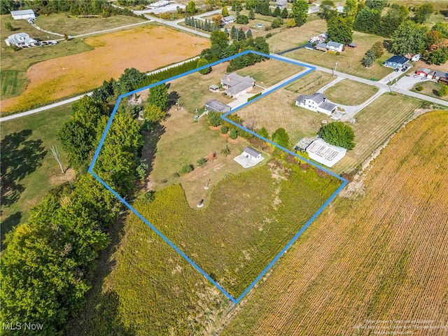 birds eye view of property featuring a rural view