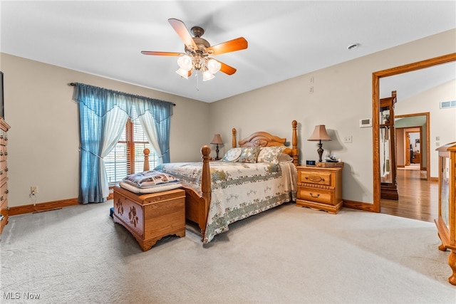 bedroom with carpet flooring, ceiling fan, and lofted ceiling