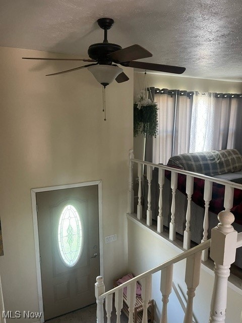 foyer featuring a textured ceiling