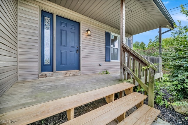 doorway to property featuring a porch