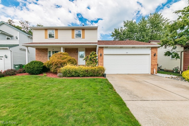 view of front property with a garage and a front lawn