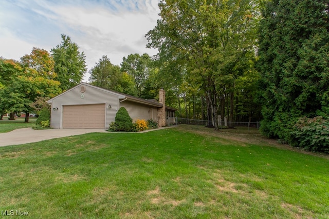 view of front of property featuring a front lawn and a garage