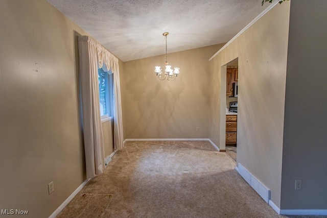 unfurnished dining area featuring a chandelier, a textured ceiling, light colored carpet, and vaulted ceiling