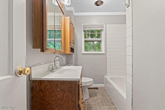 bathroom with a textured ceiling, vanity, toilet, and tile patterned floors