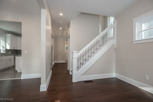 stairs with wood-type flooring