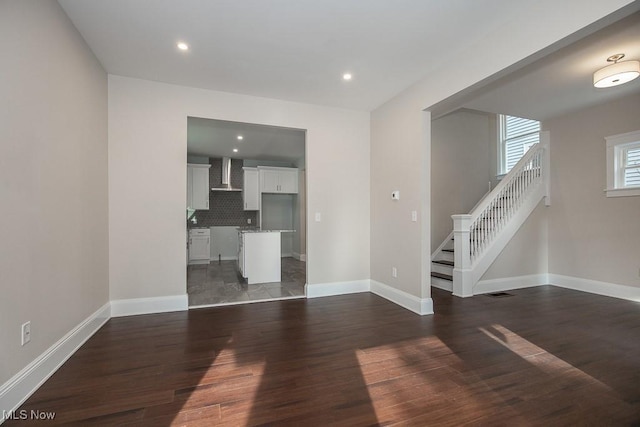 1360 E 114th St, Cleveland, OH 44106 - unfurnished living room featuring recessed lighting, stairs, baseboards, and wood finished floors
