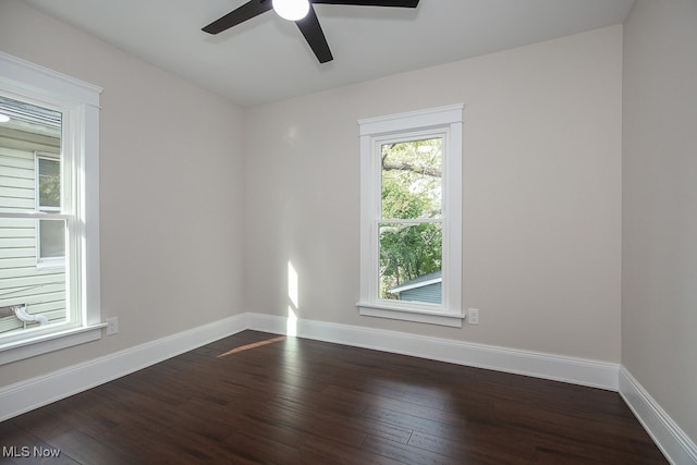 spare room featuring ceiling fan and dark hardwood / wood-style flooring