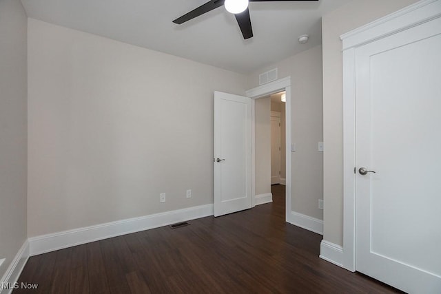 1360 E 114th St, Cleveland, OH 44106 - unfurnished bedroom featuring visible vents, baseboards, and dark wood-style floors