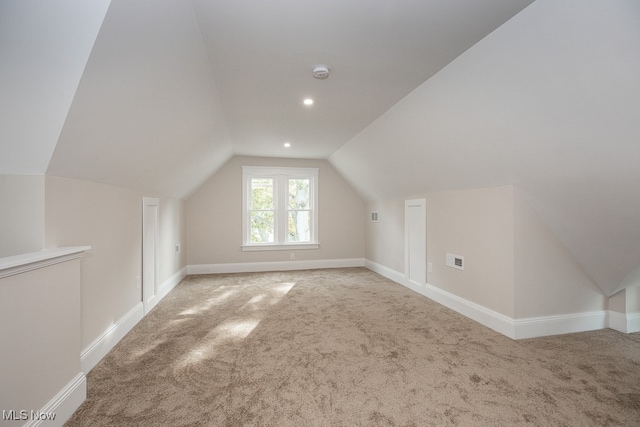 bonus room with carpet and lofted ceiling